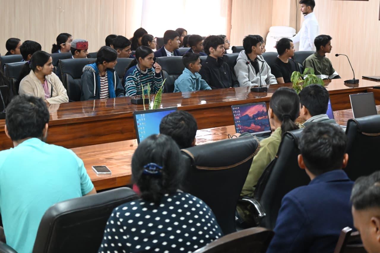 Students attentively listening to career guidance presentations.